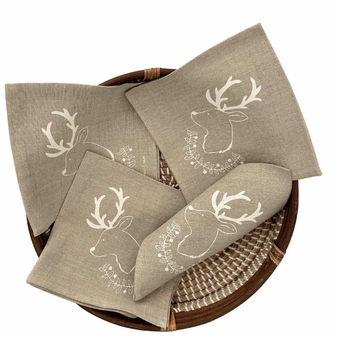 Set of 4 white Christmas deer and garland linen napkins designed by Thea and Sami