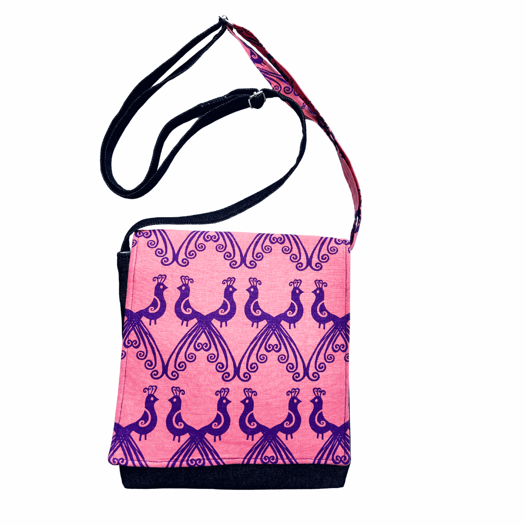 Compact purple peacock cross-body denim satchel with adjustable strap and magnetic clasp closure
