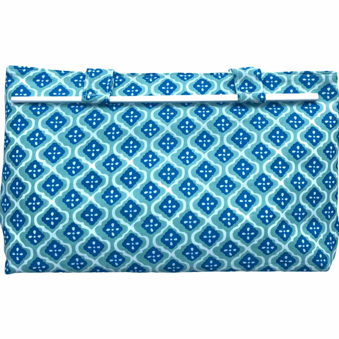 Noosa Escape Chopstick Handle Clutch Bag with blue and sea green block-printed fabric and white chopstick handles