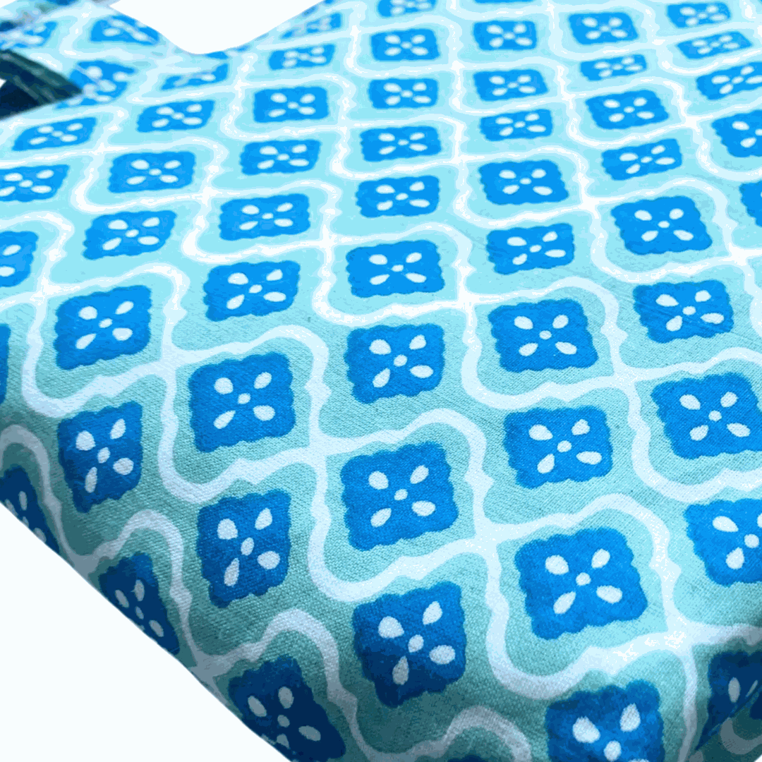 Noosa Escape Chopstick Handle Clutch Bag with blue and sea green block-printed fabric and white plastic chopstick handles