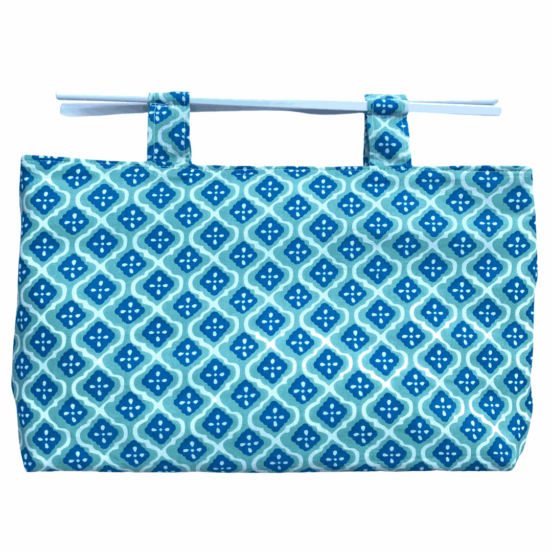 Noosa Escape Chopstick Handle Clutch Bag with vibrant blue and sea green block-printed fabric and white chopstick handles