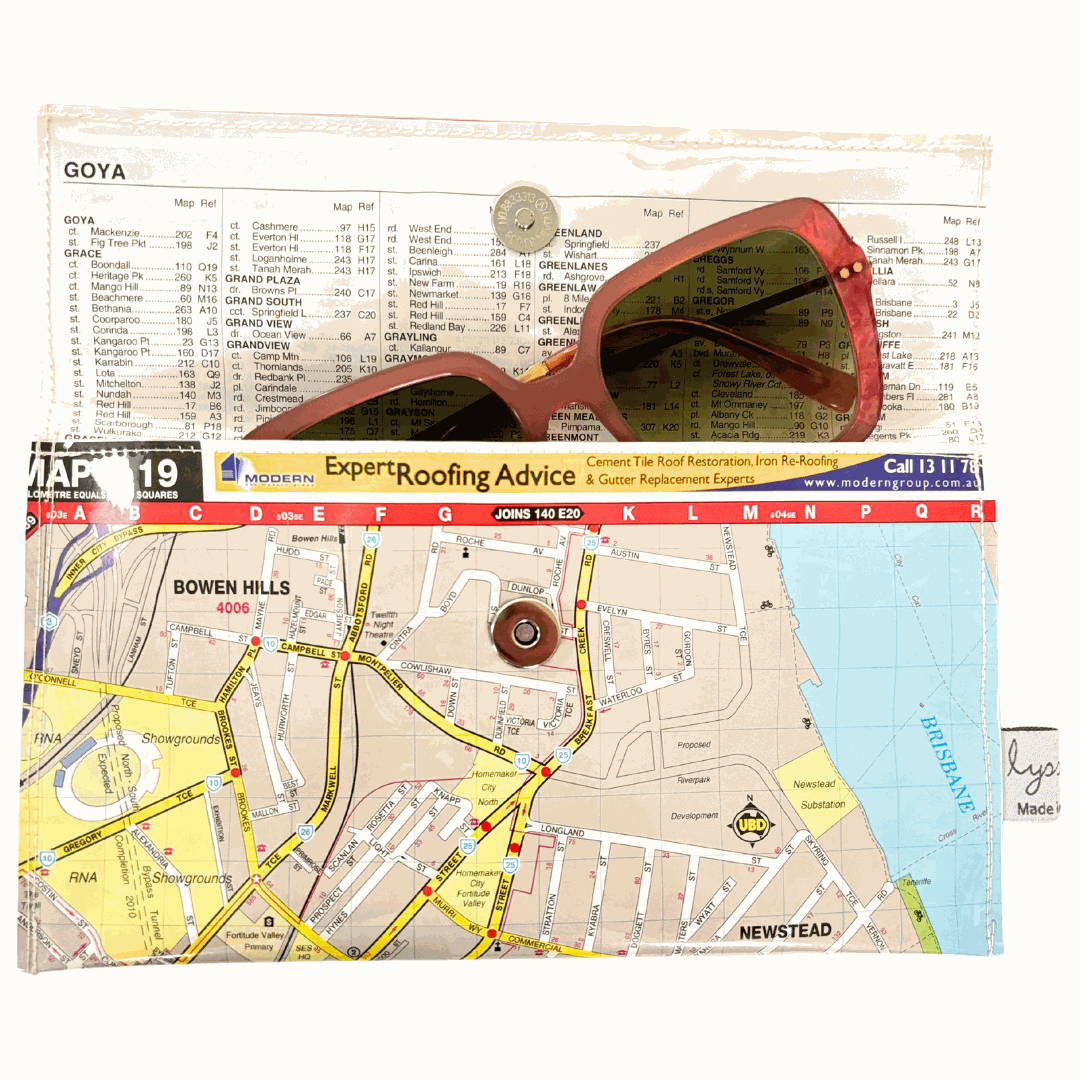 Handmade Street Map wallet created from original street directory pages by Lyssy May. Perfect to keep things clean in your bag such as glasses, medicines, facemasks, travel documents and currency. inside view with sunglasses inside.