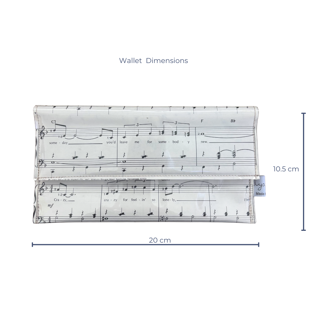 Dimensions of a handmade wallet with musical notation design on a white background