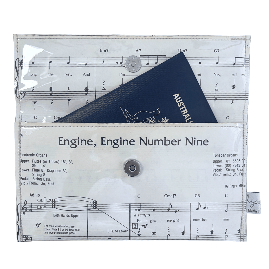 Vintage sheet music wallet featuring "Engine, Engine Number Nine" lyrics and notes with magnetic clasp