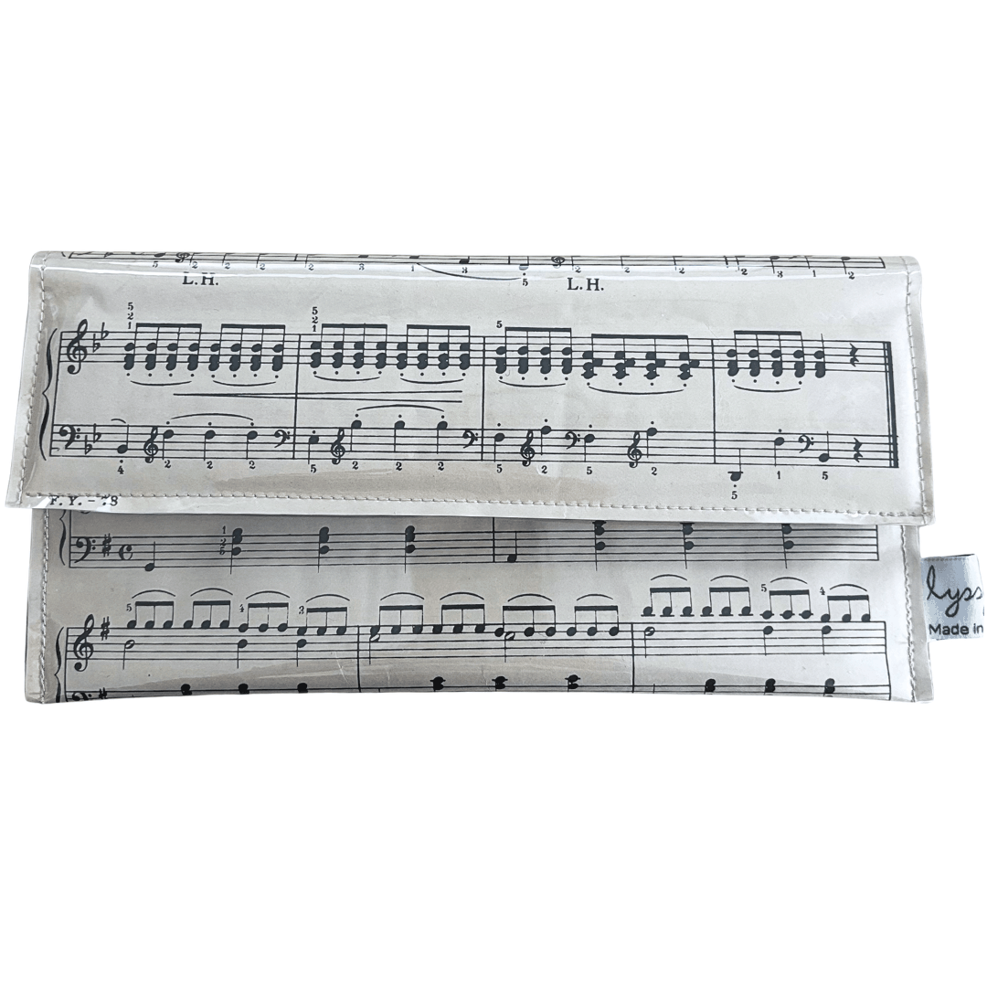 Handmade slimline wallet made from original 1940s piano lesson book pages, featuring Pattering Raindrops by Adelung, handcrafted in Queensland Australia