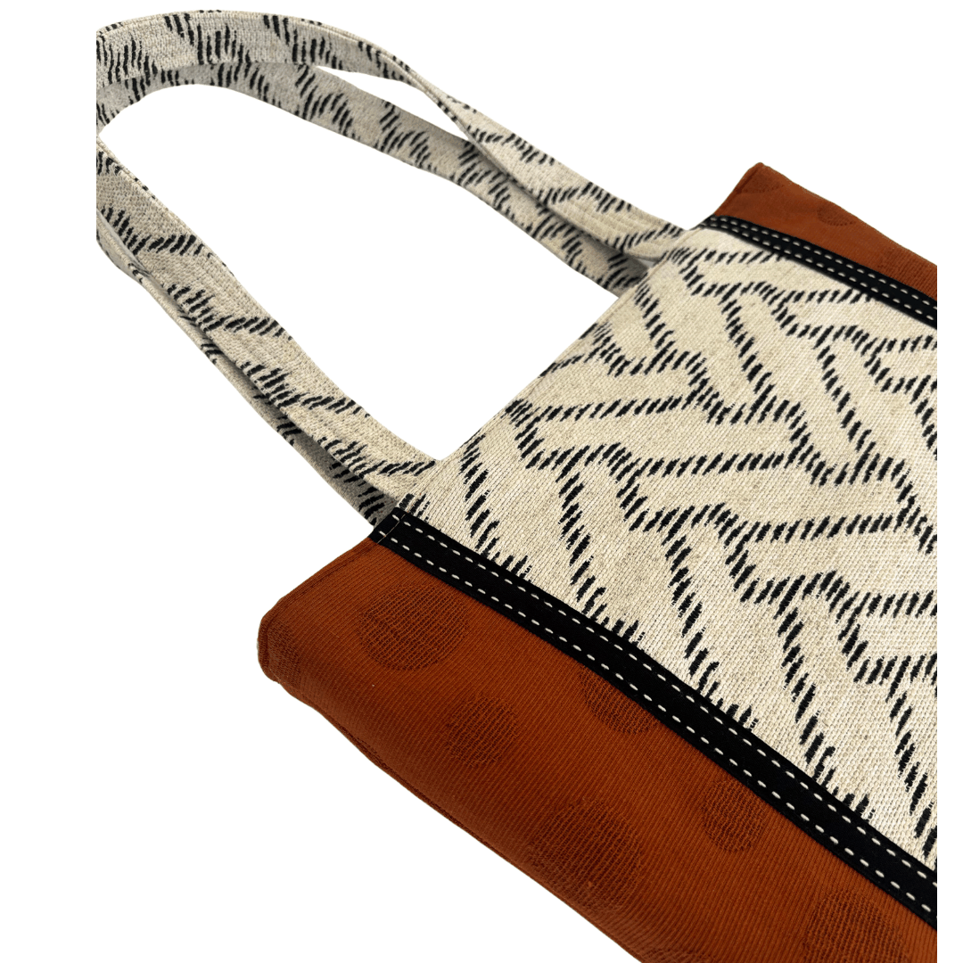 Close-up of black and white woven chevron handle with cream topstitching on handcrafted Japanese cotton tote – Lyssy May