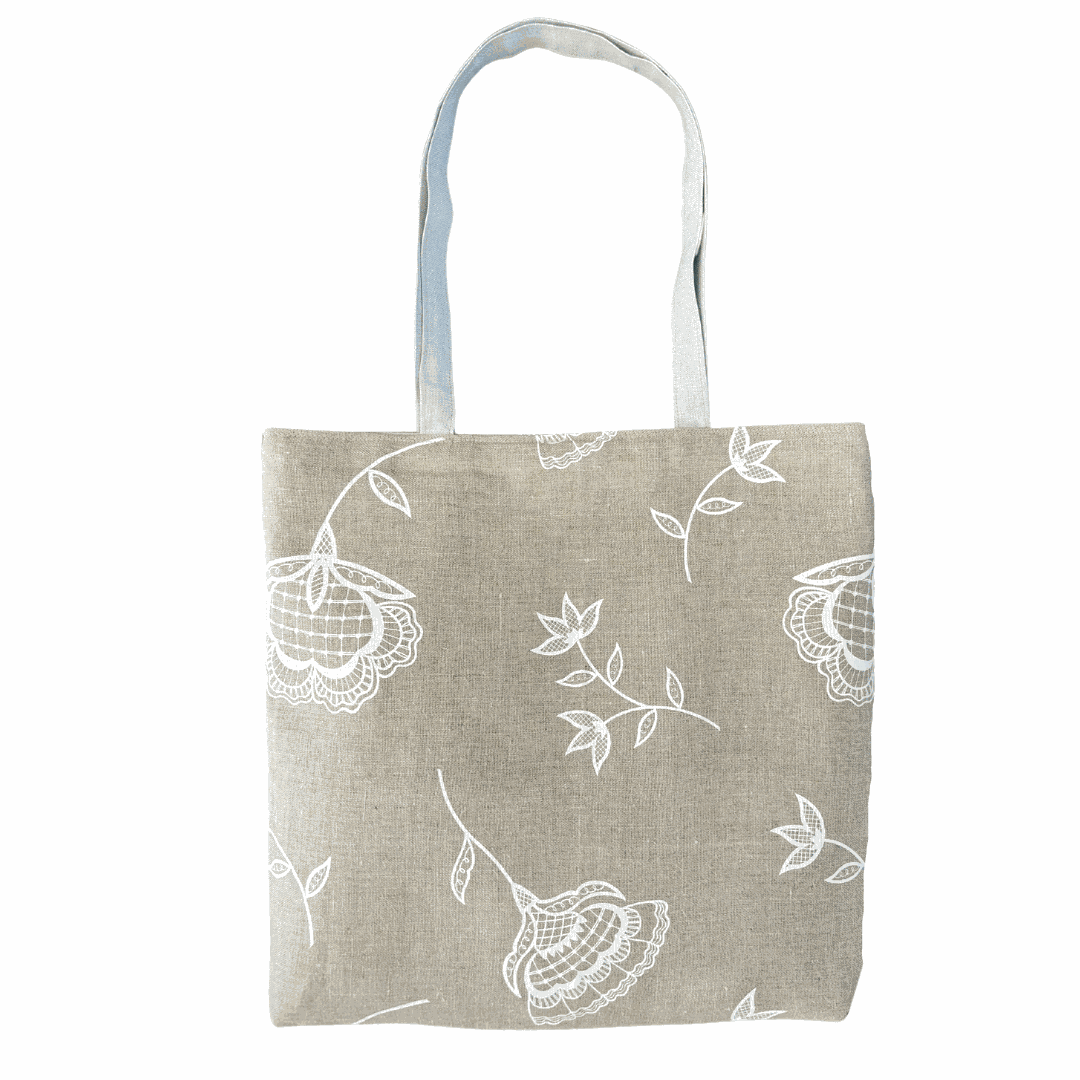 Handprinted Bohemian Blooms large natural linen tote bag with blue handles and white floral print