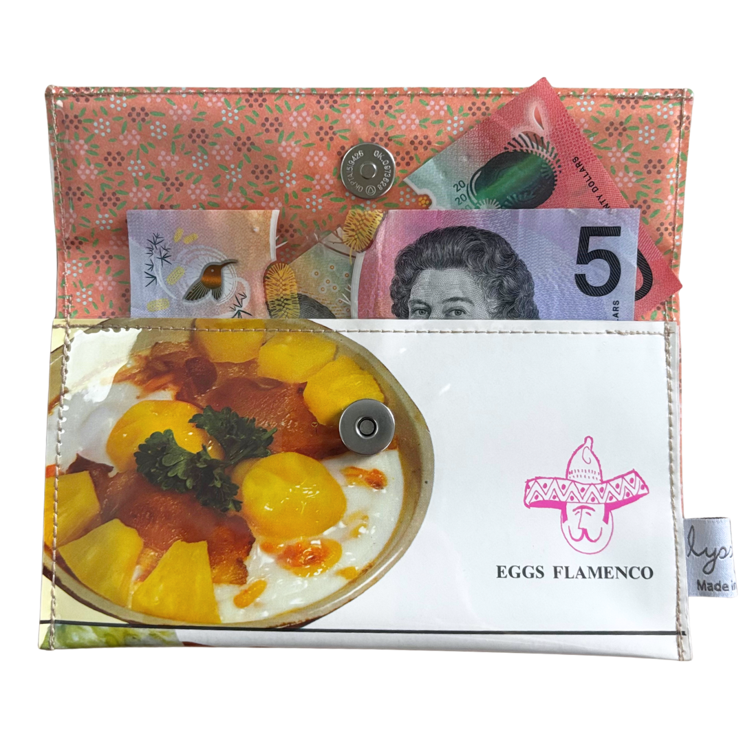 handmade wallet with a design of eggs flamenco, money, and a brand logo.