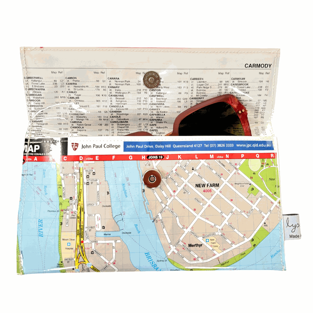 Map wallet by Lyssy May of New Farm with sunglasses on top, against a white background
