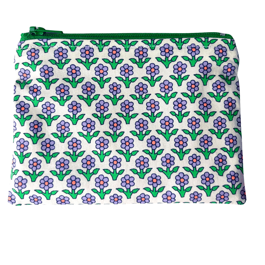 Floral patterned pouch with a green zipper on a white background