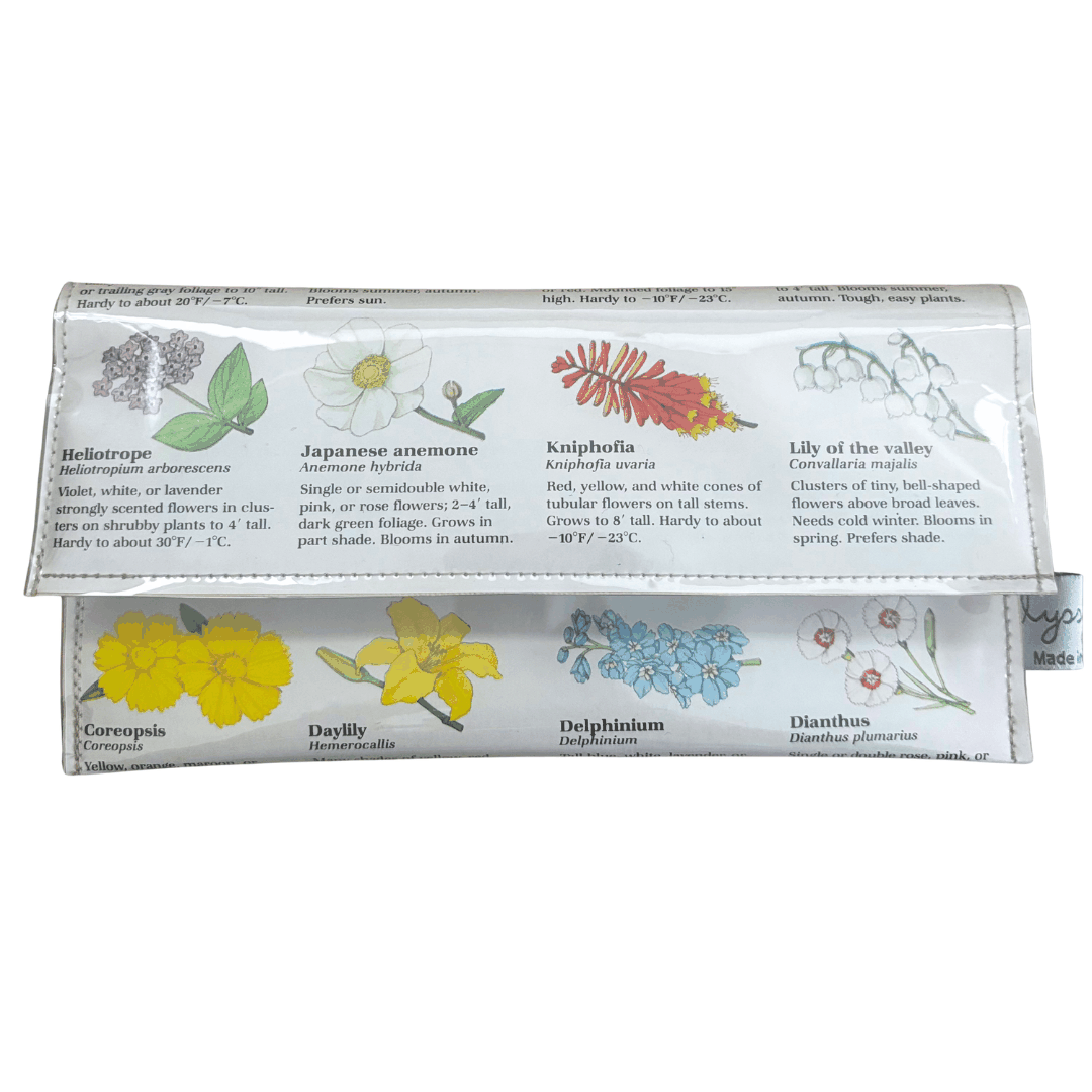Lyssy May handmade wallet featuring pages from a vintage gardening book featuring illustrations of flowers.Front view of wallet.