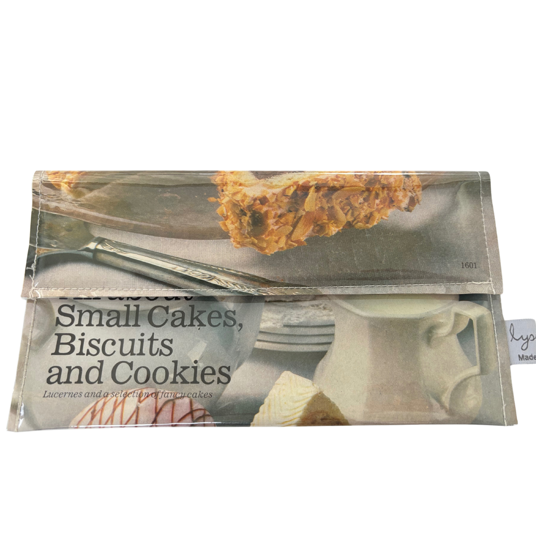 handmade wallet featuring original pages of a retro recipe book featuring cakes biscuits and cookies