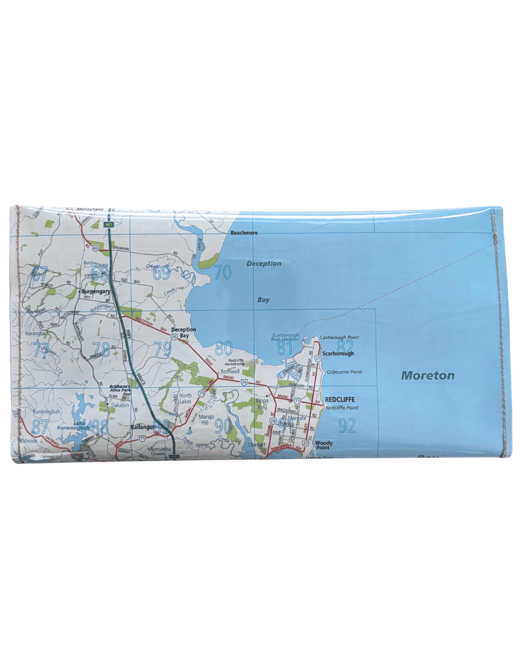 Recycled street map wallet featuring Moreton Bay suburbs from original Brisbane UBD map pages, clear PVC covered and stitched, magnetic closure. Back view.