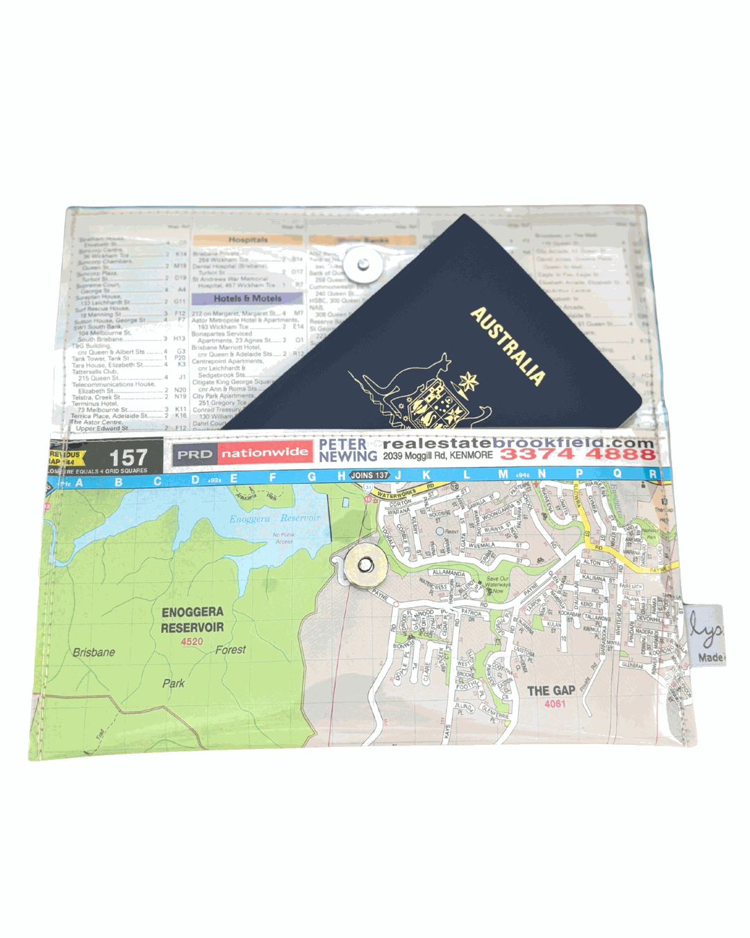 Recycled street map wallet featuring Mt Coot-tha and Brisbane suburbs design, made from vintage UBD directory pages. Inside view showing lining and passport in the wallet. Magnetic clip closure.