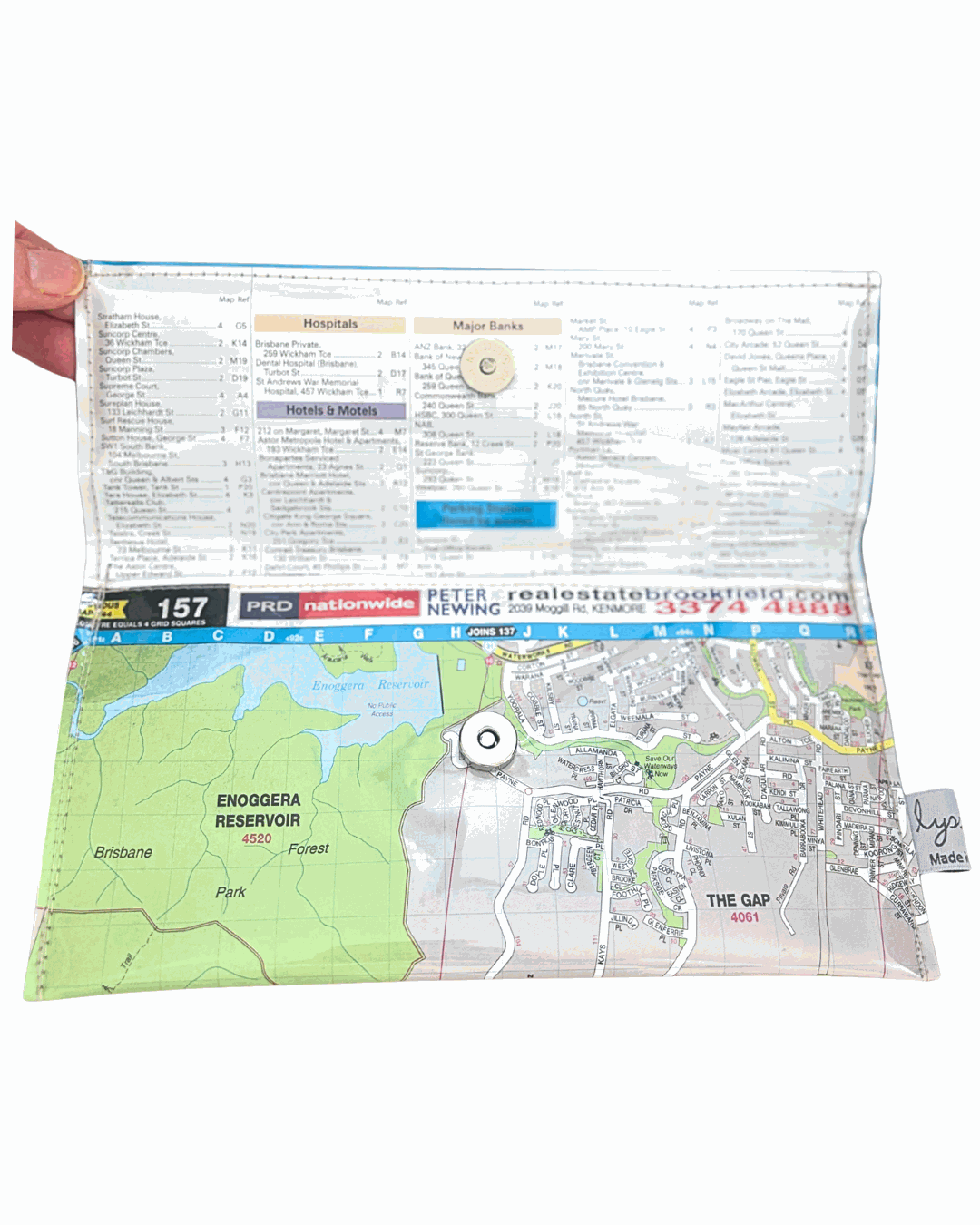 Recycled street map wallet featuring Mt Coot-tha and Brisbane suburbs design, made from vintage UBD directory pages. Inside view with magnetic clip closure.
