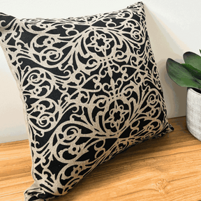 Handprinted fretwork cushion cover in black on natural linen with architectural design