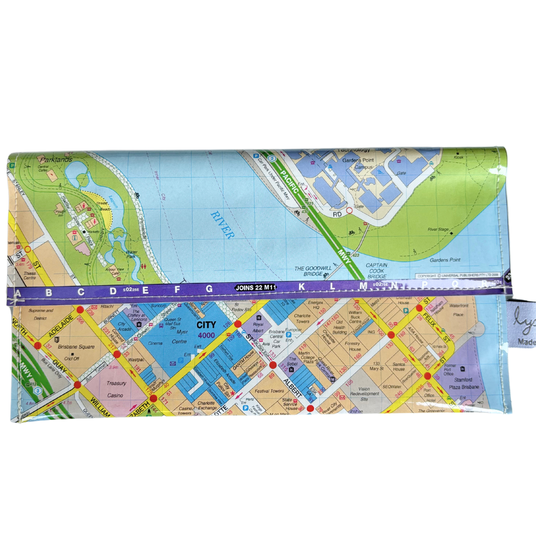 A wallet made out of a recycled Brisbane street map, featuring various colors representing different areas and roads, with a visible magnetic clip closure.