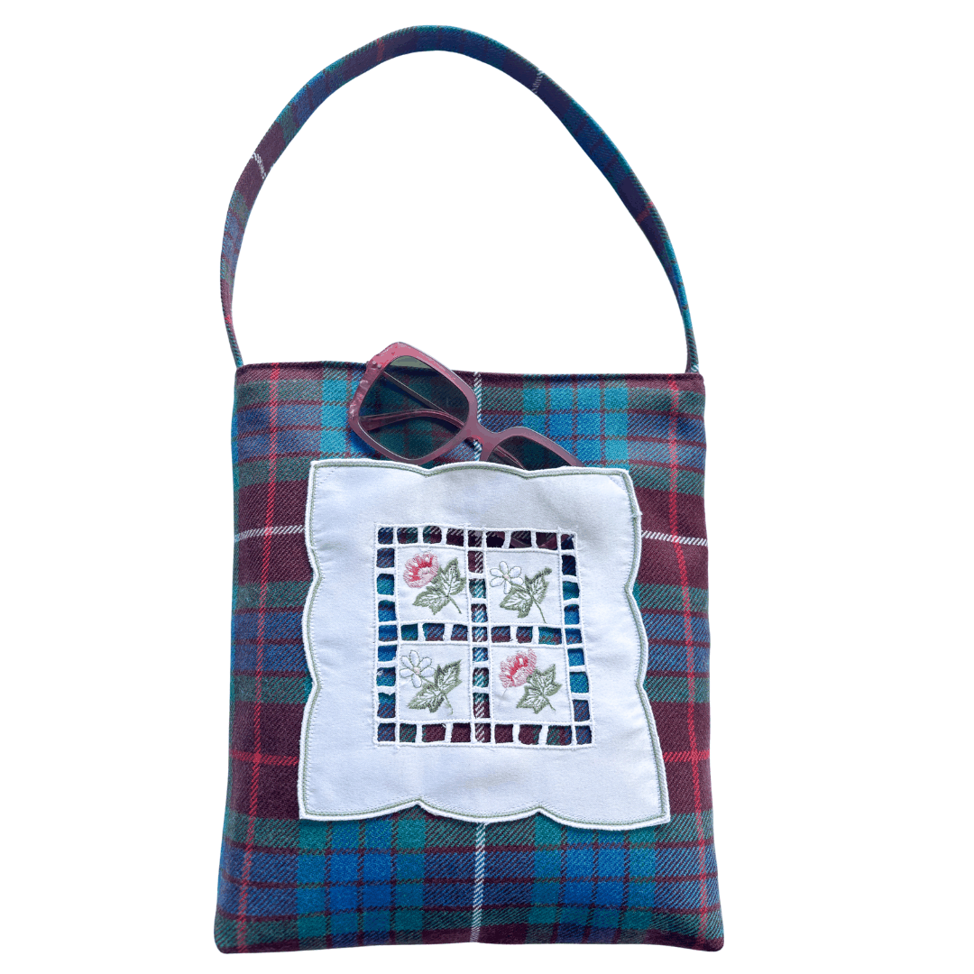 Vintage fabric shopper bag in Clan Fraser tartan with embroidered floral doily pocket and shoulder strap