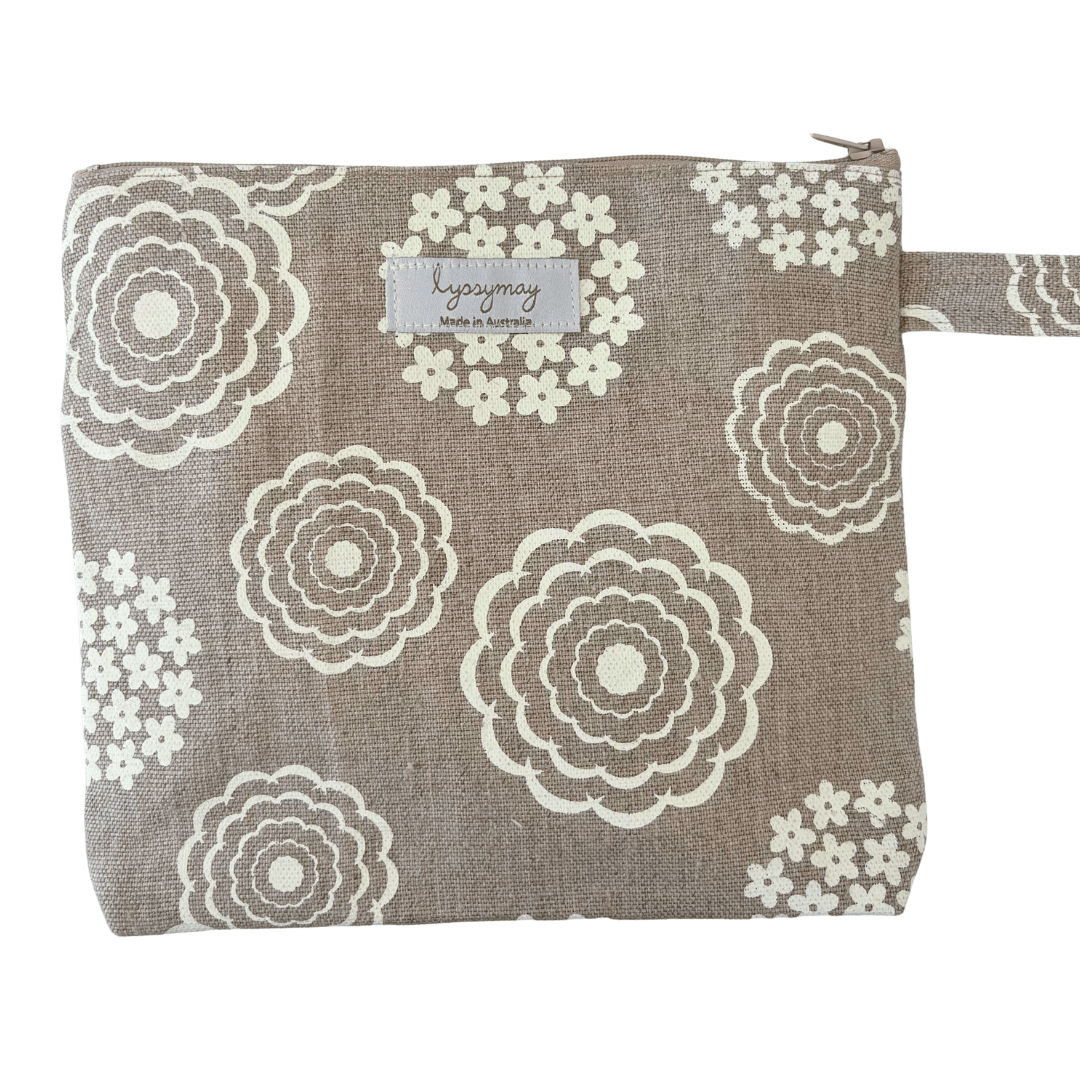 Floral patterned pouch with a lyssymay brand label on a white background