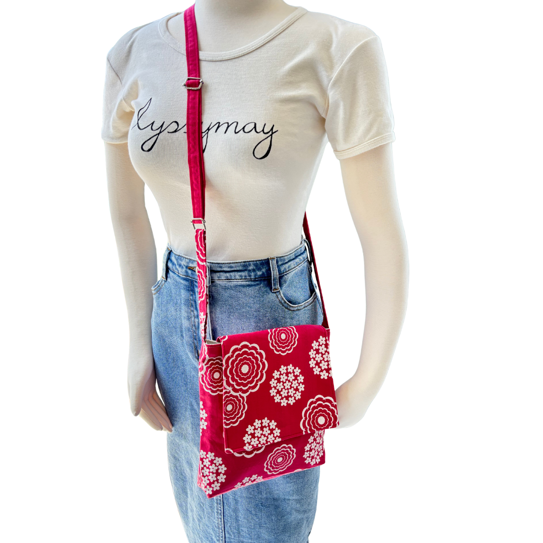 Handmade Cross Body Bag with adjustable strap that is perfect as a bag to travel overseas to hold your passport and other essentials. This floral fabric design is lightweight and has been treated with fabric protector.
