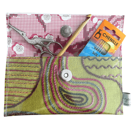 Vintage 1950's magazine wallet with colorful embroidery stitches on green linen and floral paper lining