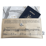 Vintage sheet music wallet featuring Haydn's Minuet from 1940s piano book, lined with botanical wallpaper and magnetic clasp