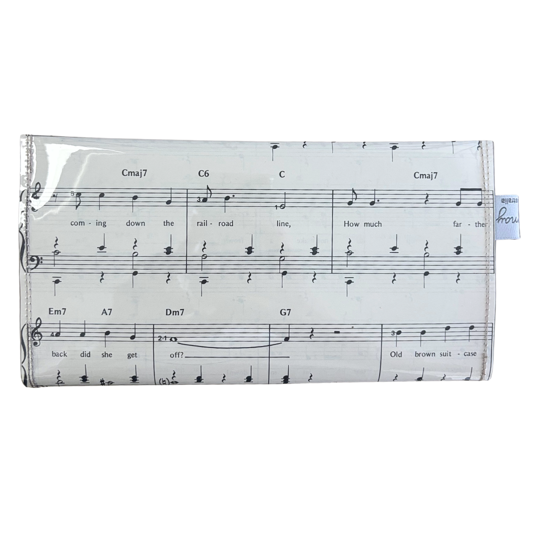 backview of handmade wallet with sheet music design on a white background