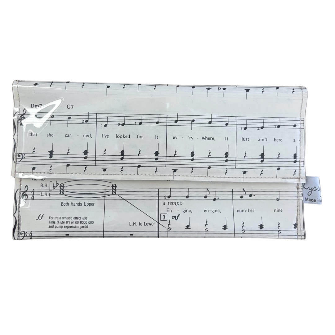 handmade wallet with music sheet design on a white background
