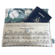 Vintage sheet music wallet made from 1940s piano lesson book page featuring "Pattering Raindrops" and "Crossing the Bridge" with floral wallpaper lining and magnetic clasp