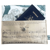 Vintage sheet music wallet handcrafted from 1940s piano lesson book page featuring Spring Song and Evening Song with floral wallpaper lining