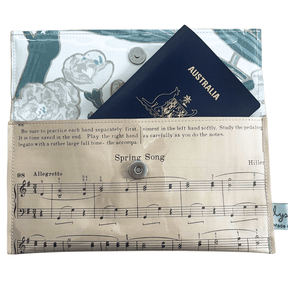 Vintage sheet music wallet handcrafted from 1940s piano lesson book page featuring Spring Song and Evening Song with floral wallpaper lining