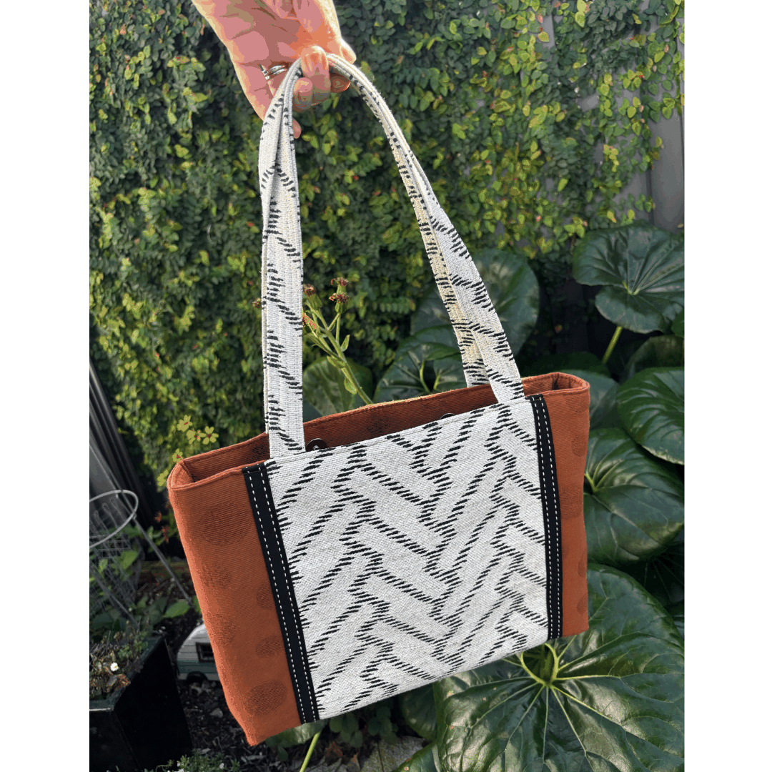 Burnt Caramel Noir handcrafted shoulder bag photographed in natural light showing full front and structured silhouette – Lyssy May