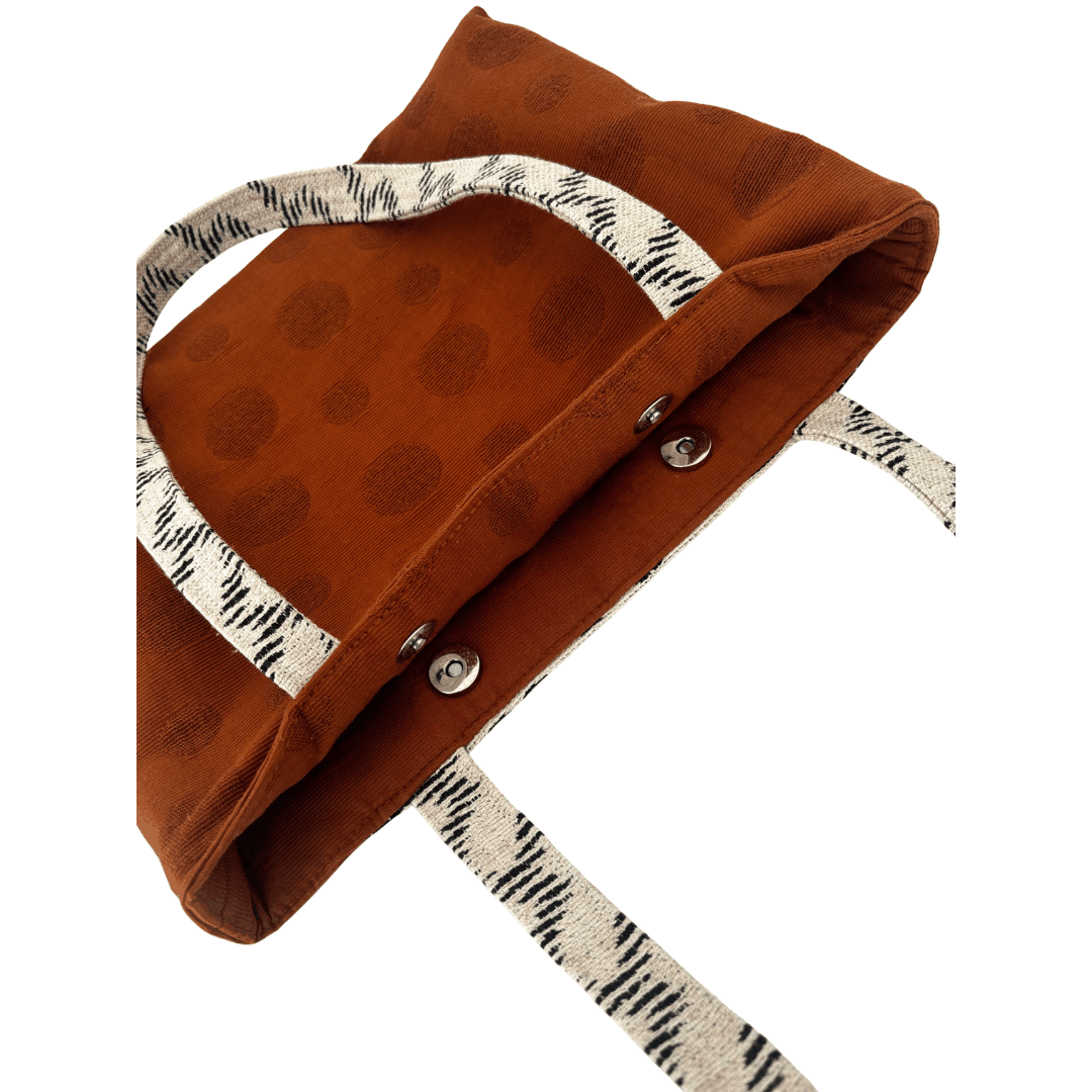 Detail of double magnetic clasp closure and burnt toffee polka dot Japanese cotton panel on handcrafted tote – Lyssy May