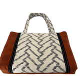 Front-on view of Burnt Caramel Noir handcrafted shoulder bag on white background showing full chevron jacquard panel and black ribbon trim – Lyssy May