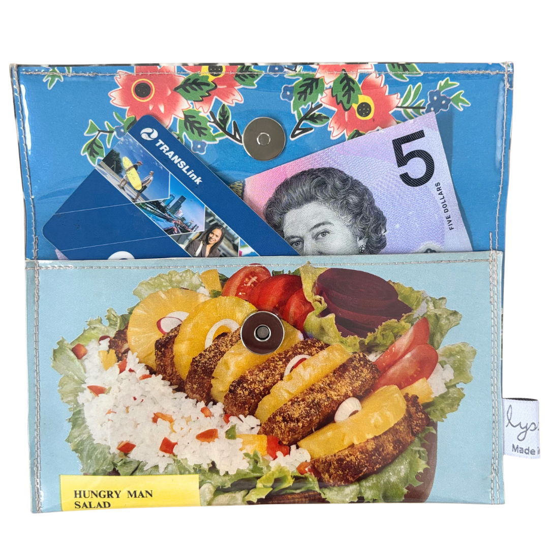 Multifunctional pouch with a salad design, money, and card on a white background