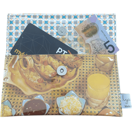 Retro Recipe Wallet made from 1960s cookbook pages featuring Banana Boats, Curry, and Kabobs meals on rattan background