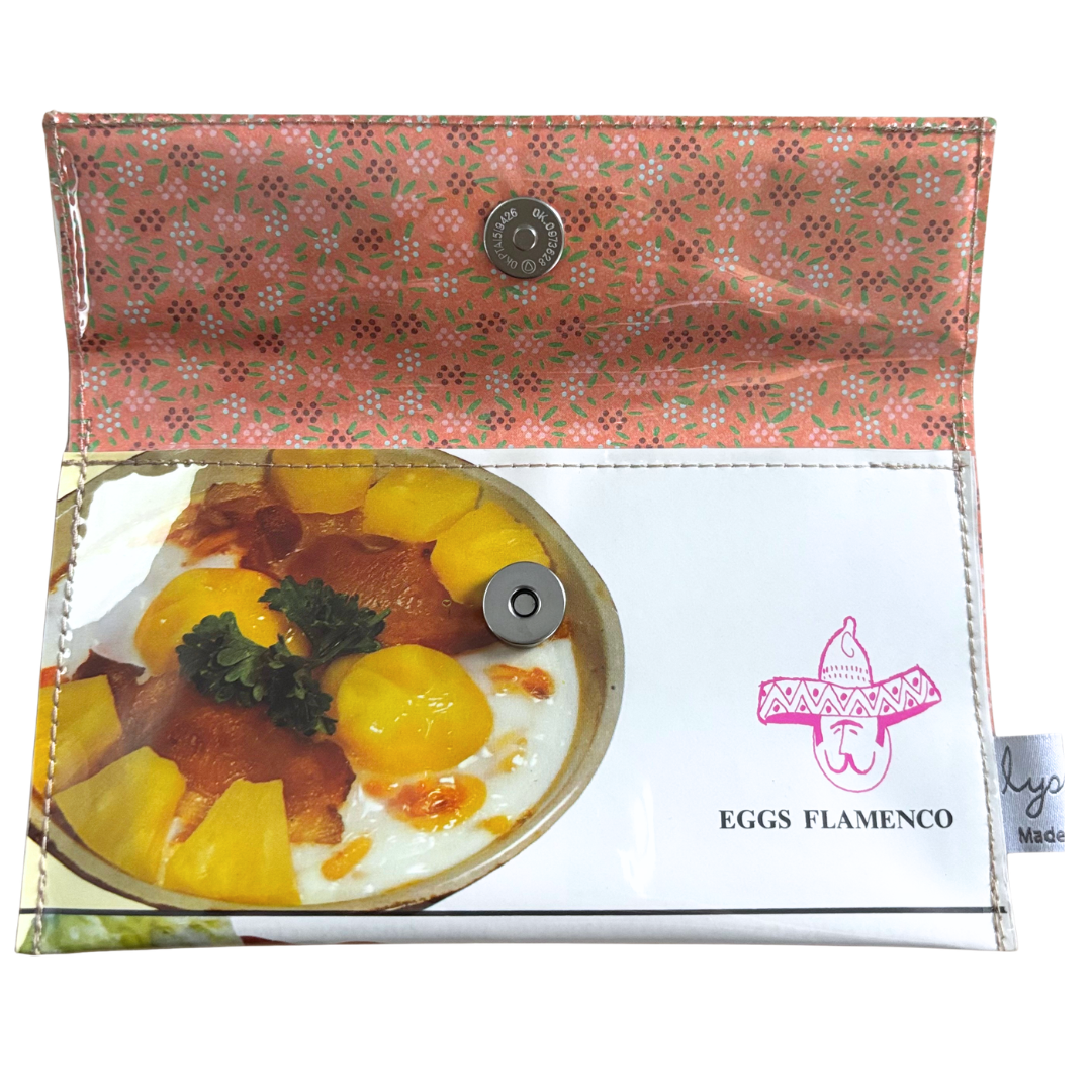 inside wallet with 'Eggs Flamenco' branding on a white background