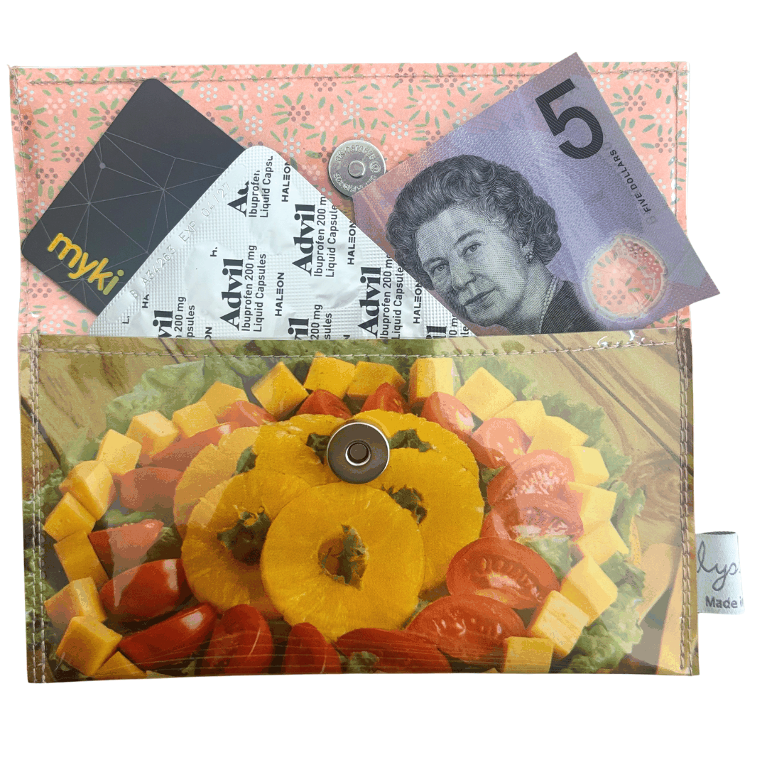 Lyssy May handmade wallet featuring original page from Golden Circle Cookbook from the 1960s. This shows the wallet open and that it fits an Australian $5 note, headache medication and credit car.