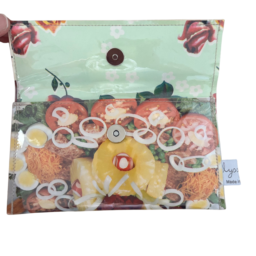 handmade wallet with food-themed design on a white background