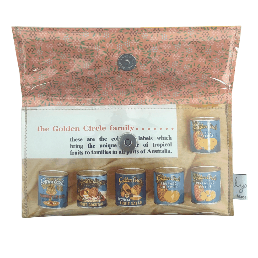 handmade wallet featuring image of packaging of Golden Circle tropical fruit tins with a decorative label.