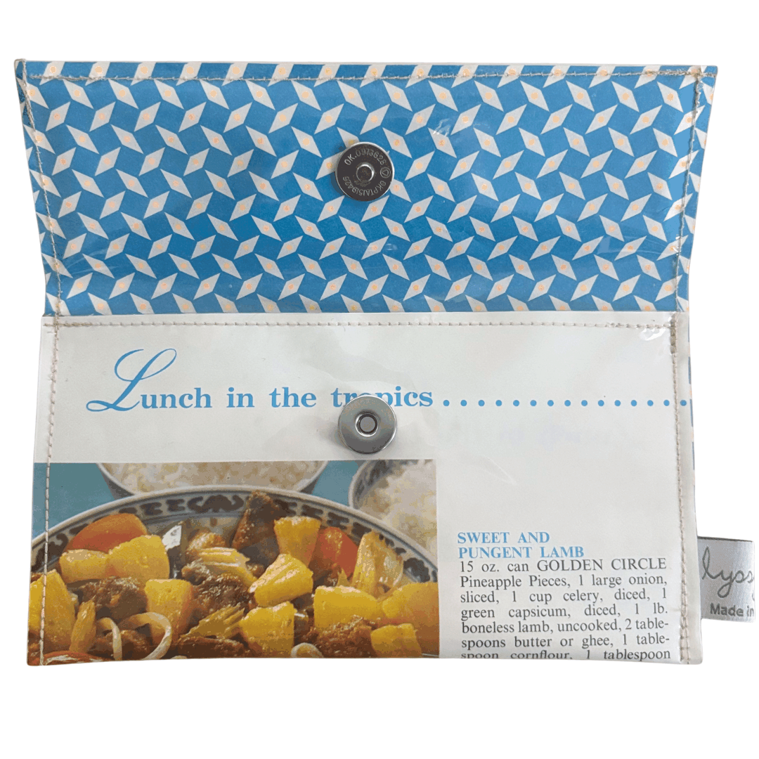 Retro recipe wallet made from vintage 1960s cookbook pages with tropical lunch recipes. closes with magnetic clip.