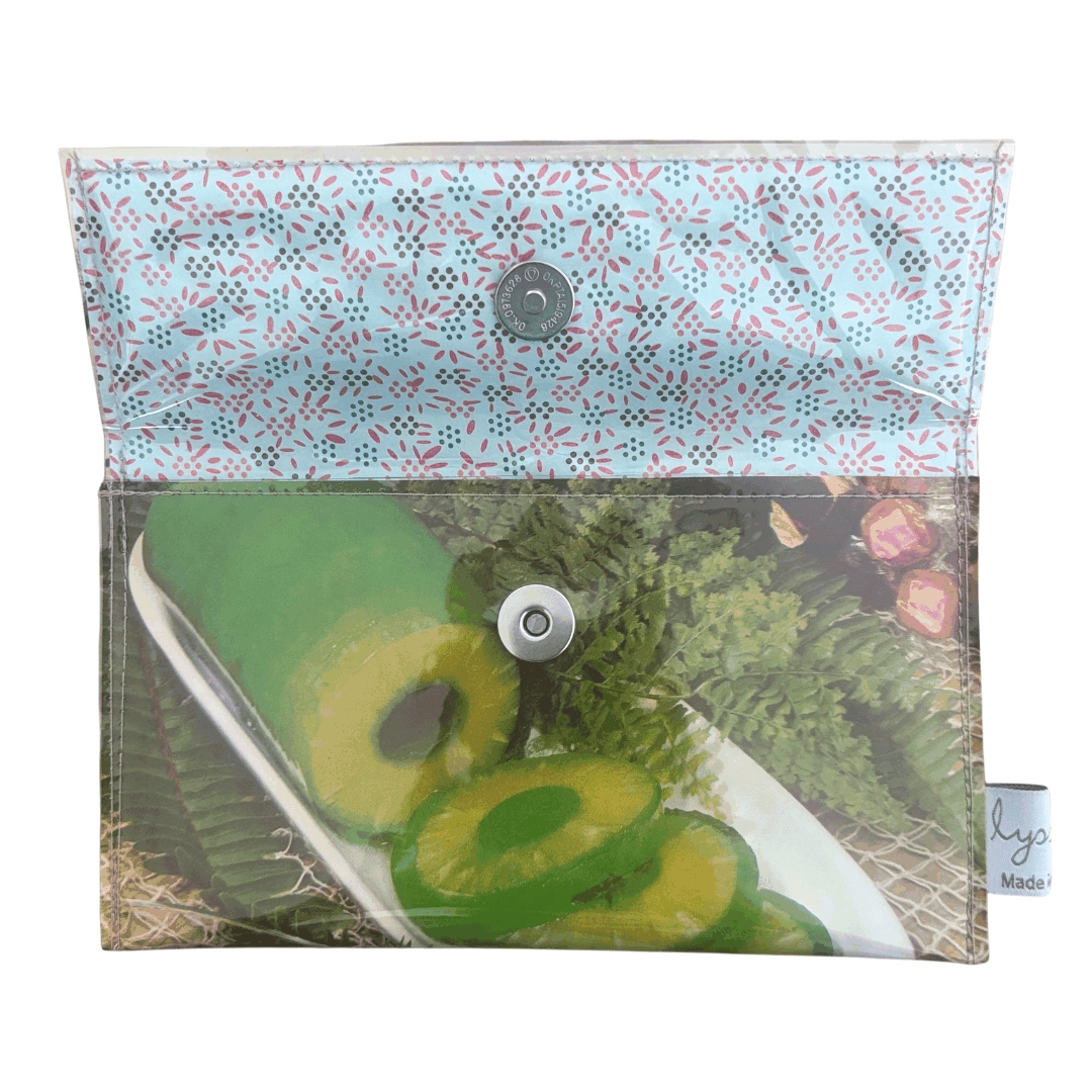 inside view of handmade lyssymay wallet showing pineapple image and metal clasp closure