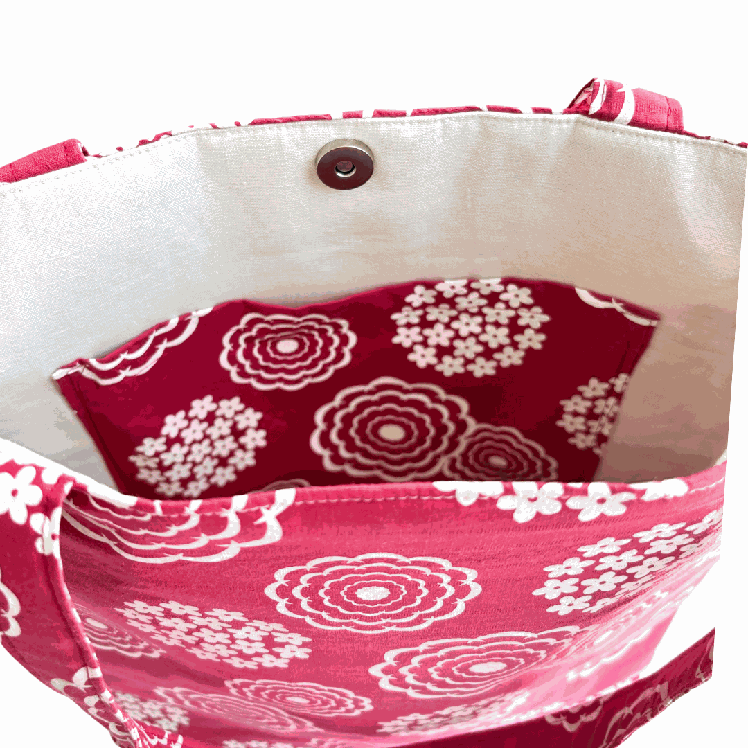 Close-up of inside pocket of LyssyMay handprinted fabric bag with red and white floral pattern