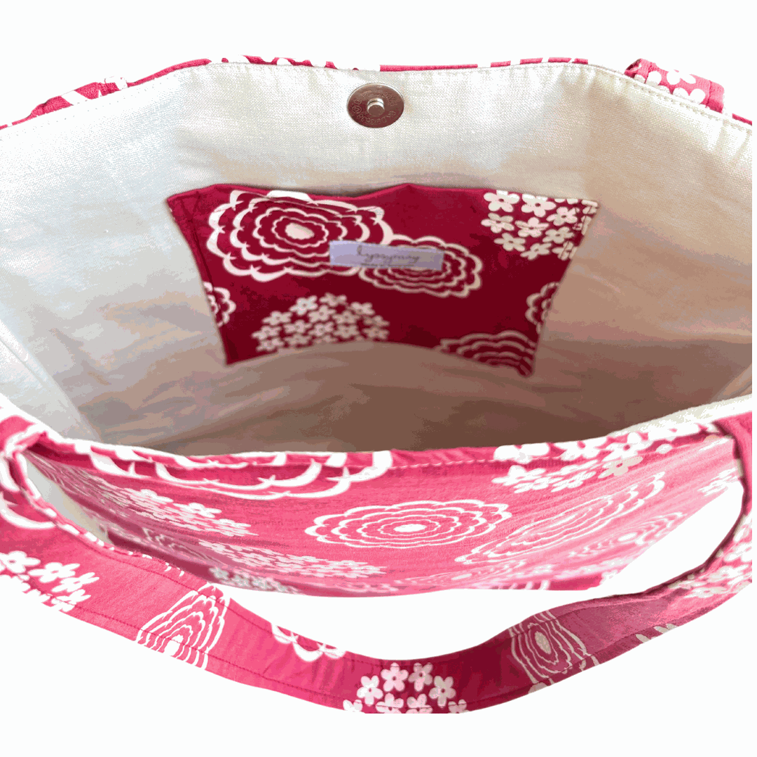 Close-up of inside of LyssyMay handprinted pink and white patterned bag with inside pocket