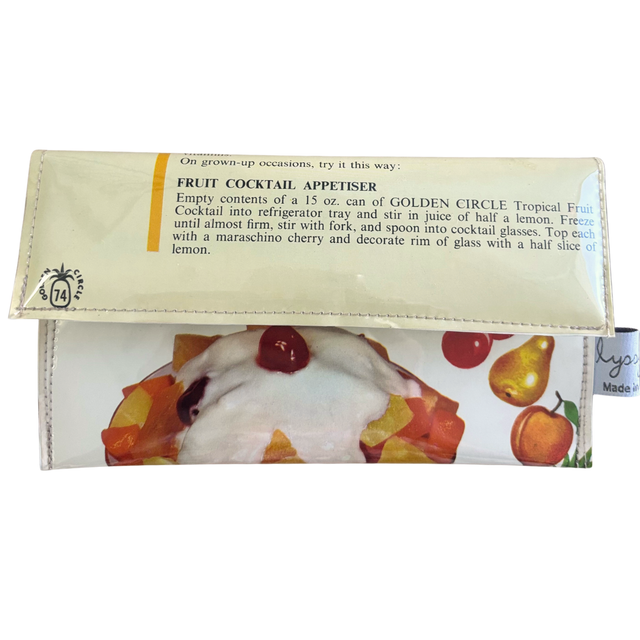 Handmade wallet with fruit-themed design and text on a white background