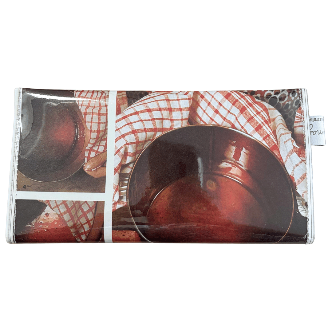 Wallet with a pattern of a person holding a checkered tea town and holding a bowl.