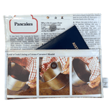 Wallet with a printed design featuring cooking instructions and images on a white background