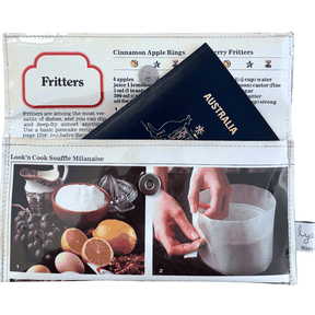 Retro recipe wallet made from 1970s cookbook pages featuring Souffle and Fritters recipes with lemon, grapes, eggs, and cinnamon apple rings designs.