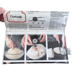 Slimline retro recipe wallet featuring 1970s jam donuts and custards cookbook pages with magnetic clasp and navy white apron design