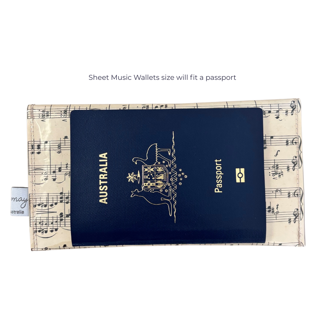Passport in a handmade sheet music wallet with musical notes on a white background